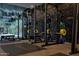 Weight room with squat racks, weights, and textured walls at 7180 E Kierland Blvd # 1116, Scottsdale, AZ 85254