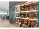 The wine cellar features custom lighting and elegant wood paneling, providing a sophisticated backdrop for the curated wine selection at 7180 E Kierland Blvd # 1116, Scottsdale, AZ 85254