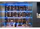 This modern wine cellar includes an LED-lit glass showcase, offering a stylish way to store and display your favorite wines at 7180 E Kierland Blvd # 1116, Scottsdale, AZ 85254