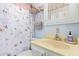 Well-lit bathroom featuring a butterfly-themed shower curtain and pastel accents at 8700 E University Dr # 1205, Mesa, AZ 85207