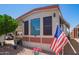 Cozy home featuring charming landscaping and a convenient golf cart parked nearby at 8700 E University Dr # 1205, Mesa, AZ 85207