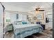 Serene bedroom with blue tones, decorative pillows, and ample natural light creating a calming retreat at 8700 E University Dr # 1205, Mesa, AZ 85207