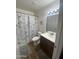Cozy bathroom with a vanity sink, shower and tub combination with an Eiffel Tower themed shower curtain at 903 W Jacinto Cir, Mesa, AZ 85210