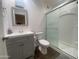 Modern bathroom featuring grey vanity and shower with glass doors at 903 W Jacinto Cir, Mesa, AZ 85210