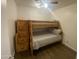Bedroom featuring a bunk bed, wood-look floors, and natural light from the window at 903 W Jacinto Cir, Mesa, AZ 85210
