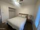 Bedroom with queen bed, window and ceiling fan at 903 W Jacinto Cir, Mesa, AZ 85210