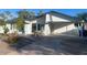 Charming single-story home boasts a well-manicured lawn and ample parking on the driveway for your vehicles at 903 W Jacinto Cir, Mesa, AZ 85210