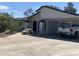 Charming single-story home featuring a covered parking area, landscaped yard, and concrete picnic table at 903 W Jacinto Cir, Mesa, AZ 85210