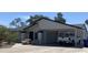 Inviting single-story home featuring a carport, landscaped yard, and charming concrete picnic table at 903 W Jacinto Cir, Mesa, AZ 85210