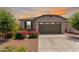 Charming single-story home boasts a desert landscape, two-car garage, and delightful curb appeal at 9325 W Montecito Ave, Phoenix, AZ 85037