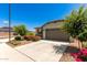 Charming single-story home with a two-car garage and desert landscaping at 9325 W Montecito Ave, Phoenix, AZ 85037