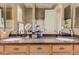 Bathroom vanity boasts double sinks, granite countertops, and ample storage space under the cabinets at 10529 E Posada Ave, Mesa, AZ 85212