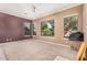 Bright bedroom with carpet floor, multiple windows offering views of the outdoor scenery at 10529 E Posada Ave, Mesa, AZ 85212