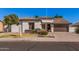 Attractive single-level home with a well-maintained yard and a two-car attached garage at 10529 E Posada Ave, Mesa, AZ 85212