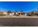 Charming single-story home featuring a tile roof, desert landscaping, and a two-car garage at 10529 E Posada Ave, Mesa, AZ 85212