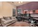 The office features wood floors, a ceiling fan and lots of space to sit, relax and work at 10529 E Posada Ave, Mesa, AZ 85212