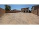 Large vacant backyard with privacy fence offering potential for landscaping and outdoor living at 12408 W Orange Dr, Litchfield Park, AZ 85340