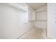 Walk-in closet with built-in shelving and ample storage space, ready for personalization at 12408 W Orange Dr, Litchfield Park, AZ 85340