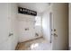 The laundry room boasts a 'Loads of Fun' sign and ample room for laundry tasks at 12408 W Orange Dr, Litchfield Park, AZ 85340