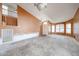Living room with neutral walls, staircase, and shuttered windows at 12408 W Orange Dr, Litchfield Park, AZ 85340