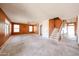 Spacious living room with staircase and entry featuring three large windows providing lots of natural light at 12408 W Orange Dr, Litchfield Park, AZ 85340