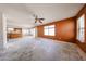 Living room with open floor plan to the kitchen and sliding doors to the backyard at 12408 W Orange Dr, Litchfield Park, AZ 85340