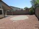 Wide backyard with rock landscaping, and mature landscaping around the perimeter at 12425 W Montebello Ave, Litchfield Park, AZ 85340
