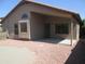 Backyard with a covered patio and low maintenance landscaping with decorative rocks at 12425 W Montebello Ave, Litchfield Park, AZ 85340