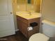 Bathroom featuring a wooden vanity with sink and commode at 12425 W Montebello Ave, Litchfield Park, AZ 85340