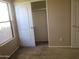 Bright bedroom with a window and closet, offering a comfortable living space at 12425 W Montebello Ave, Litchfield Park, AZ 85340