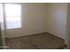 Cozy bedroom with a bright window and comfortable carpeting at 12425 W Montebello Ave, Litchfield Park, AZ 85340