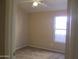 Comfortable bedroom with a ceiling fan and natural light from a window at 12425 W Montebello Ave, Litchfield Park, AZ 85340