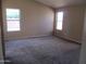 Large bedroom with vaulted ceiling and two windows at 12425 W Montebello Ave, Litchfield Park, AZ 85340