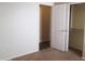 Well-lit bedroom with closet and entry doors at 12425 W Montebello Ave, Litchfield Park, AZ 85340