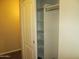 Spacious closet with shelving and hanging rod, providing ample storage space at 12425 W Montebello Ave, Litchfield Park, AZ 85340