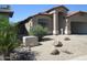Front exterior view of a home with desert landscaping and covered entryway at 12425 W Montebello Ave, Litchfield Park, AZ 85340