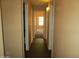 Inviting hallway with neutral walls, connecting various rooms in the home at 12425 W Montebello Ave, Litchfield Park, AZ 85340