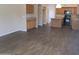 Open kitchen and living room with wood cabinets and updated flooring at 12425 W Montebello Ave, Litchfield Park, AZ 85340