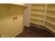Laundry room with washer hookups and built-in shelving for storage at 12425 W Montebello Ave, Litchfield Park, AZ 85340