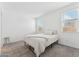 Cozy bedroom with carpet, neutral paint, and a queen-sized bed illuminated by natural light at 12672 W Marguerite Ave, Avondale, AZ 85323