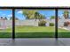 View of the backyard featuring a lush lawn, block wall and tasteful landscaping at 13224 N 31St Pl, Phoenix, AZ 85032