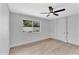 Light-filled bedroom with a garden view featuring ample storage and neutral décor at 13224 N 31St Pl, Phoenix, AZ 85032