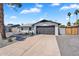 Single-story home with a well-maintained lawn, a paved driveway, and mature trees at 13224 N 31St Pl, Phoenix, AZ 85032