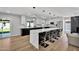 Well-lit kitchen boasting a modern island with quartz countertop and sleek cabinetry at 13224 N 31St Pl, Phoenix, AZ 85032