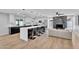 Open concept kitchen and living room with a modern island and stainless steel appliances at 13224 N 31St Pl, Phoenix, AZ 85032