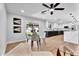 Open-concept living room seamlessly connects the kitchen and dining area with modern stylish décor at 13224 N 31St Pl, Phoenix, AZ 85032