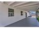 Covered patio with painted brick walls and modern windows providing an outdoor living space at 13224 N 31St Pl, Phoenix, AZ 85032