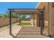 Backyard featuring a brick paver patio and a pergola with hanging lights at 14333 W Alvarado Dr, Goodyear, AZ 85395
