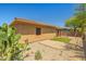 Desert landscaped backyard with a charming pergola-covered patio, perfect for outdoor living at 14333 W Alvarado Dr, Goodyear, AZ 85395