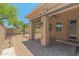 Covered patio with brick pavers, a ceiling fan, and view to the backyard at 14333 W Alvarado Dr, Goodyear, AZ 85395